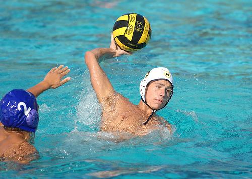 Senior Nick Goldman passes the ball to a teammate during a Menlo Boys water polo game.
