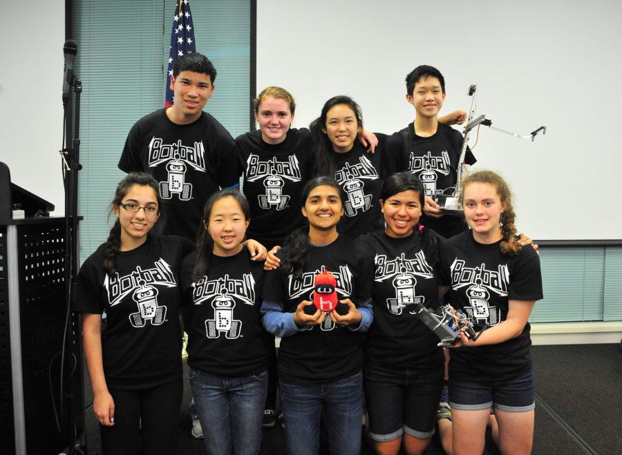 After the awards ceremony, the team celebrated the end of their season with a team picture featuring their two robots. Photo courtesy of Sally Shan Li
