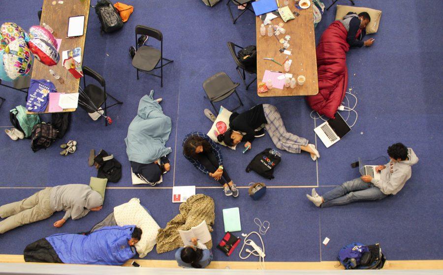 Menlo students sleeping and coding during MenloHacks. Photo courtesy of Megan Tung.