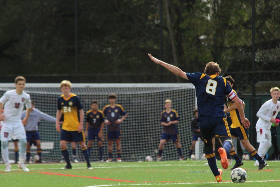 Senior Ben Lasky takes the ball up the field. Staff Photo: Bella Scola. 