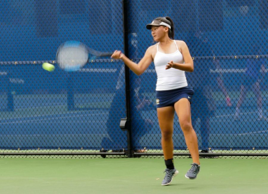 Sophomore Tricia Zhang hits a forehand in the Tyler Nii Memorial Tournament. Staff Photo: Bella Guel. 