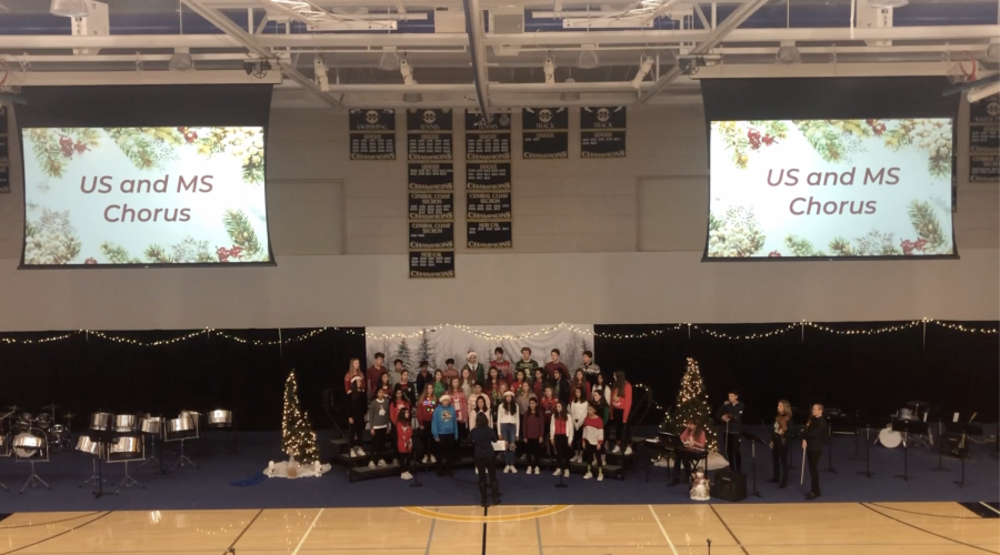 Middle and Upper school chorus come together to sing during the assembly. Staff photo: Emily Han. 
