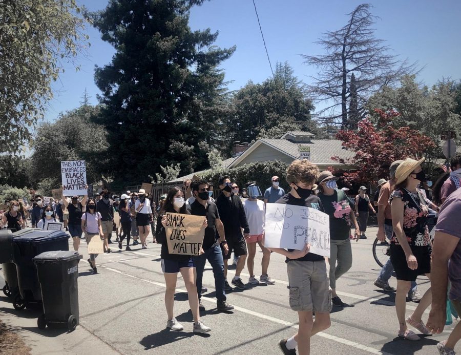 Protesters in Los Altos march on June 5 to show support for the intensifying demand to end systemic racism and police brutality in the United States. June 5 would have been the 27th birthday of Breonna Taylor, an innocent black woman shot and killed by police in her home. Staff photo: Emily Han.