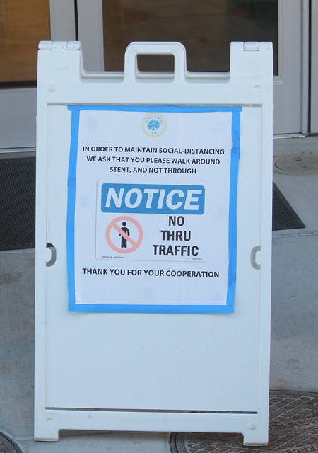 A new sign on campus instructs people to avoid walking inside Stent Hall. Staff photo: Sadie Stinson.