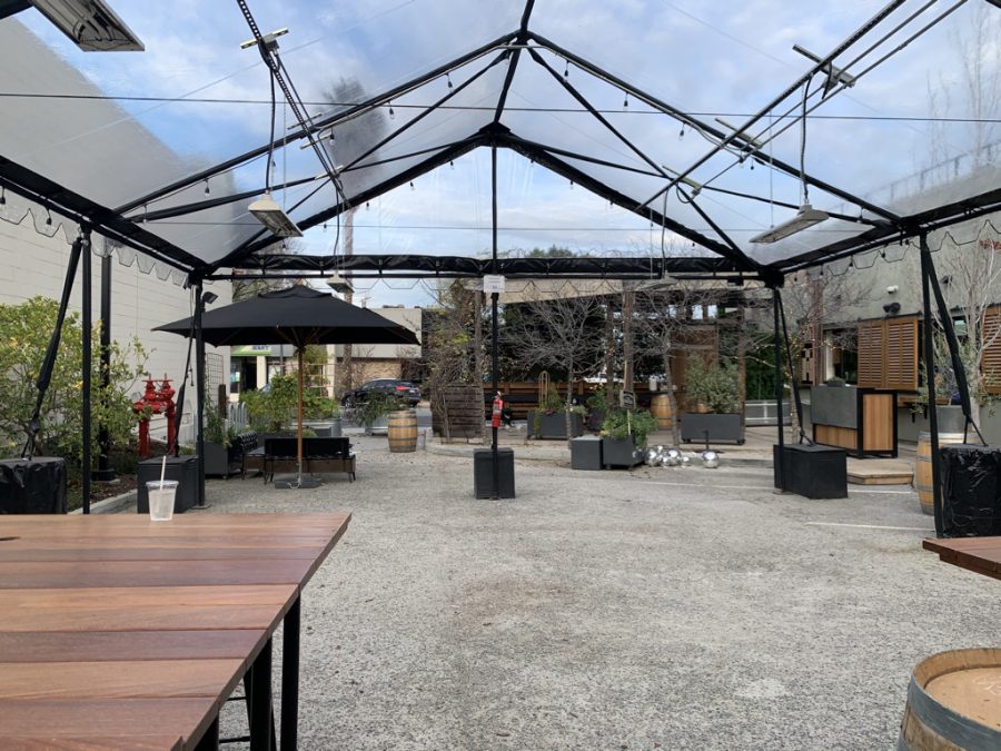 Johnstons Saltbox owner Sean Johnston created an outdoor patio  setup including several tents. When set up, the tables accommodate social distancing guidelines and regulations. Staff photo: Sofia Labatt.