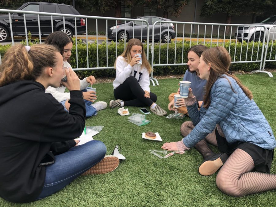 Sophomore girls enjoy hot chocolate and donuts on the loop as a part of their Random Act of Fun.  Staff photo: Erica Fenyo.