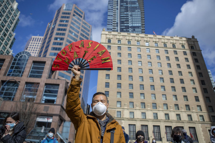 People gather at a “Stop Asian American Hate” rally in Vancouver with a protester holding a sign against anti-Chinese rhetoric. Creative commons photo: GoToVan on Flickr. 