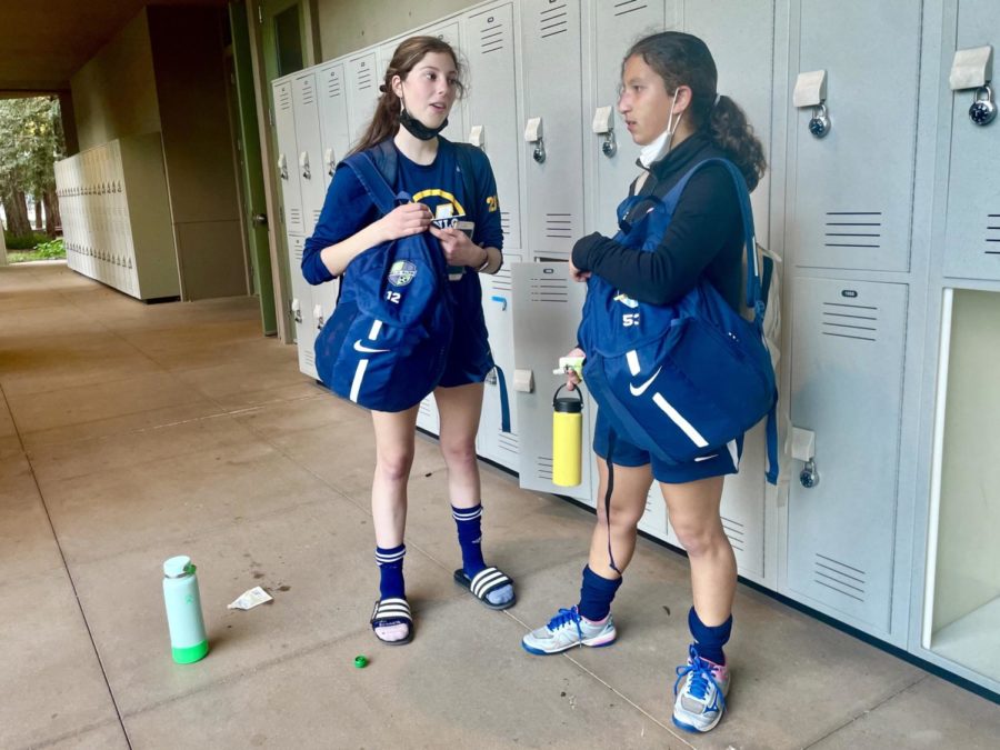Freshman varsity soccer players Amelie Giomi and Roya Rezaee stand by the lockers after their daily practice after school, talking about their practice schedule for the following week. Staff photo: Izzy Klugman. 