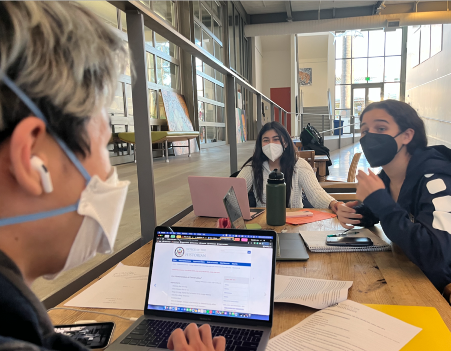 Students Zachary Ruwitch, Ana Banchs Rodriguez and Desiree Ramon-Aquino sit in the Creative Arts and Design Center after school, helping one another with AP US History projects. Staff Photo: Sophia Hinshaw.