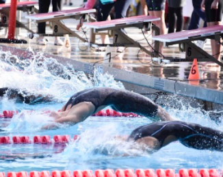 Tudor competes in a swimming meet. Photo courtesy of Emory Tudor.