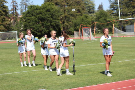 Seniors (from left to right) Claire Raney, Laynie Sheehan, Michelle Li, Riley Huddleston, Charlie Herrin and Ella Hartmanis line up for their senior day introductions before their last home game. Staff Photo by by Karen Xin
