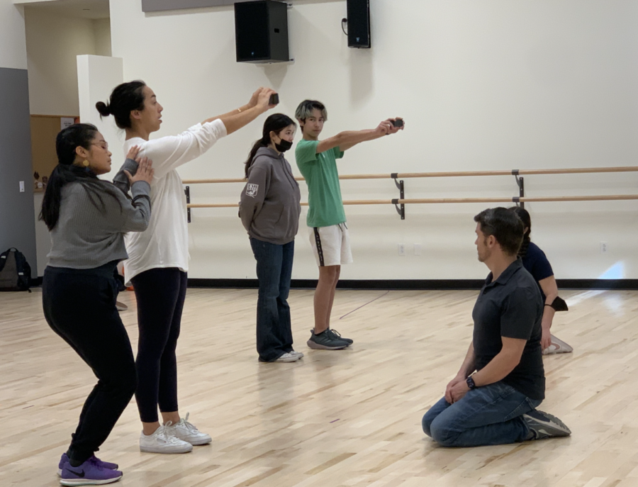 Dance teachers Lexi Viernes (far left) and Angela Curotto-Pierson (left) teach the cast the steps to the dance Miracle in “Matilda” with the Middle School Director Ryan Lewis (bottom right). Staff photo: Agnes Shao