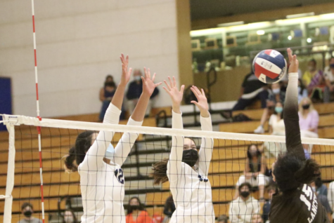 Chen attempts to block a ball with teammate Sharon Nejad against Saint Francis. Photo courtesy of Pam McKenny.