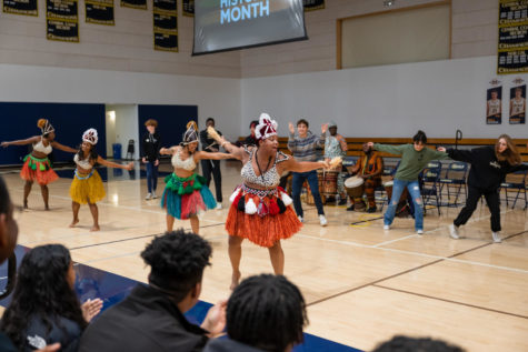 Students dance with the Diamano Coura West African Dance Company. At the Black History Month assembly, students and faculty were invited onstage to participate in the group’s dance after a solo performance from the group. Photo courtesy of Kevin Chan