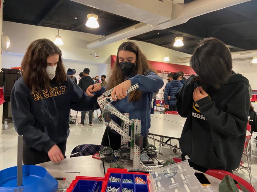 Robotics leaders Marina Xanthopoulos, Kate Little and member Sophia Chen make last-minute changes to their robot after it didn’t pass inspection at The Central Valley Vex Robotics Tipping Point Tournament on Feb. 4, 2022. Photo Courtesy of Marina Xanthopoulos