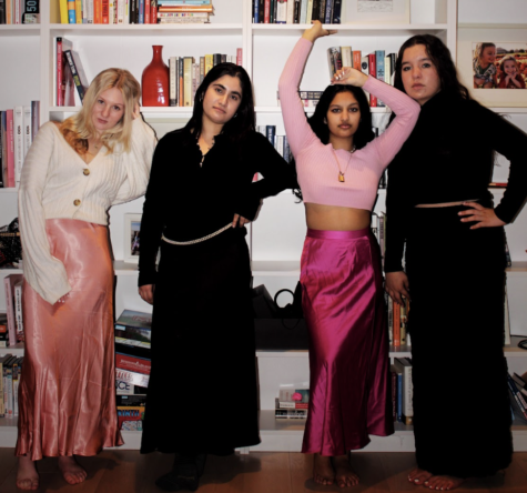 Ellie Hardegree wears a maxi skirt from H&M and a cardigan from Target. Salma Siddiqui wears a maxi skirt from Banana Republic and a sweater from Zara. Maya Debnath wears a maxi skirt from Banana Republic and a thrifted shirt. Elizabeth Powell wears a turtleneck from Target and maxi skirt from Free People. Photo by Chloe Lee