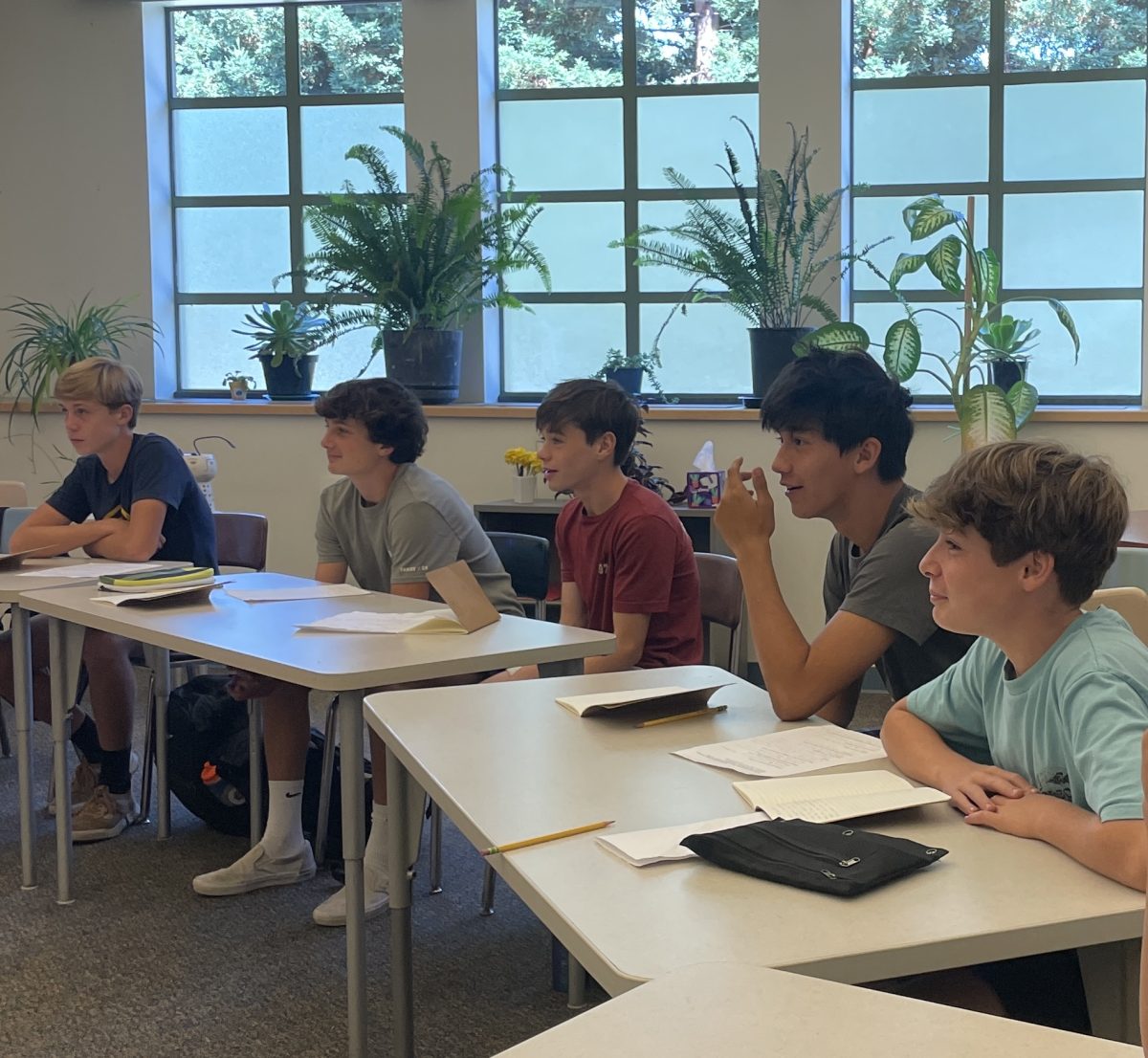 Freshmen Parker Richardson, Merrick Ward, Rafe Weiden (left to right) and Benji Rubin (far right) listen to a con-
versation between Ethics teacher Jack Bowen and freshman Charles Mura (second from right) about the ethicality of ‘flopping’ while playing soccer. “I’d learned a little about [ethics] while in Menlo Middle, but the seminar class was really cool because I got to learn about the topic in a different way,” Rubin said. Staff photo: Alyssa McAdams