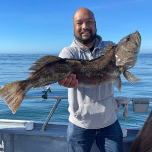 Mark Aquino poses with one of his catches. Photo courtesy of Aquino