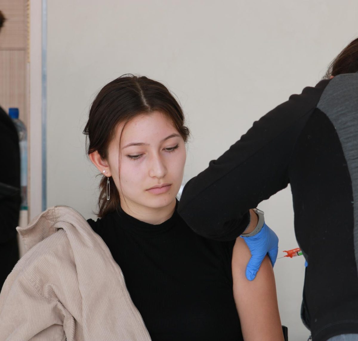 Then-sophomore Sienna Swanson gets a COVID-19 vaccine during Menlos vaccine clinic in the Spieker Center on Nov. 11, 2022.