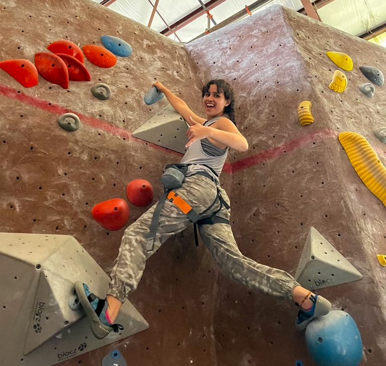 Senior Ana Banchs completes a climb during Climbing Club’s first excursion at a Movement Gym on Feb. 3.