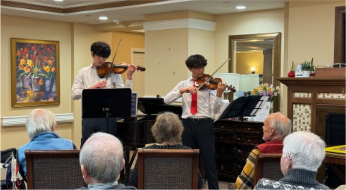 Junior Clifford Palmer and sophomore Lucas Wang perform at the Terraces at Los Altos. Photo courtesy of Jen Hsia