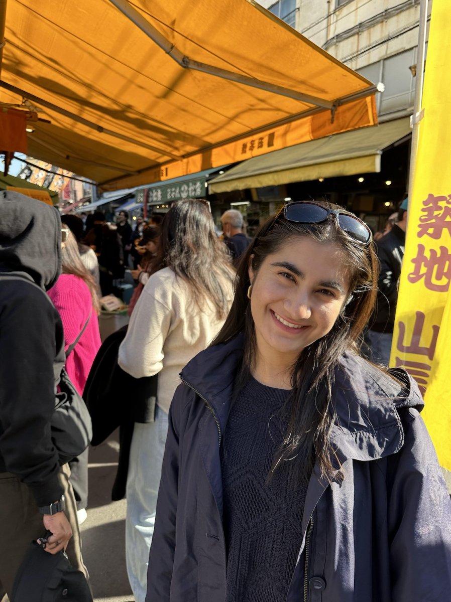 Senior Salma Siddiqui goes in search of food samples at the Tsukiji fish market in Tokyo. Photo courtesy of Siddiqui