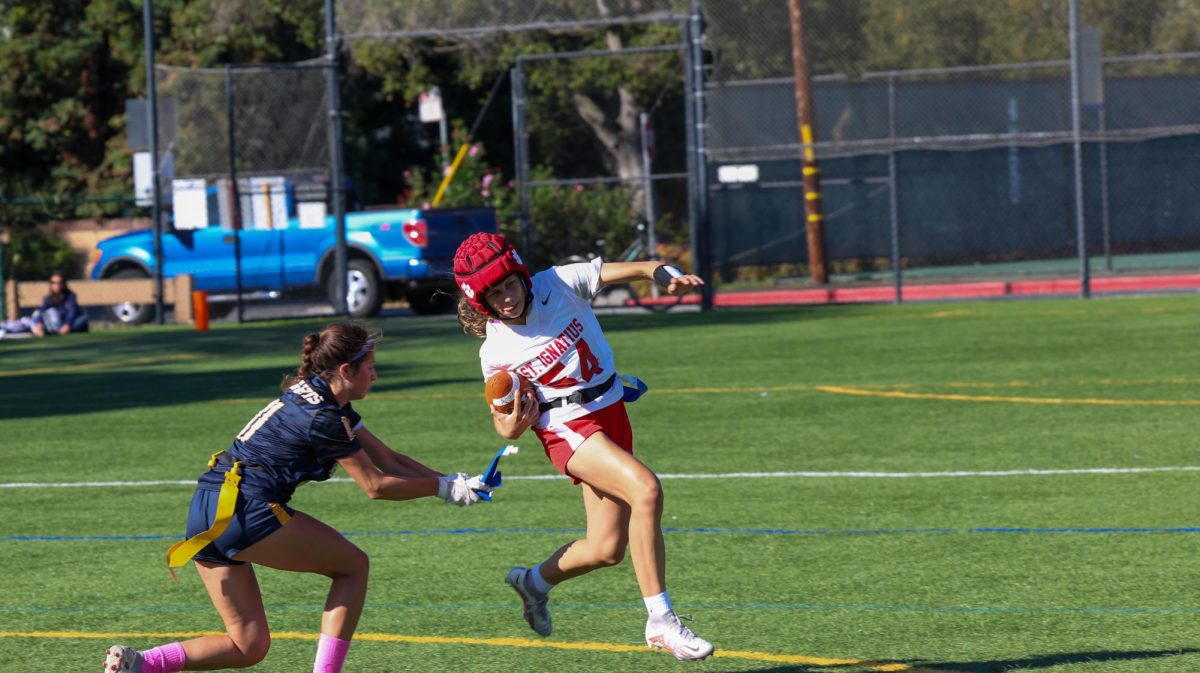 Senior Scarlett Bundy pulls a flag.