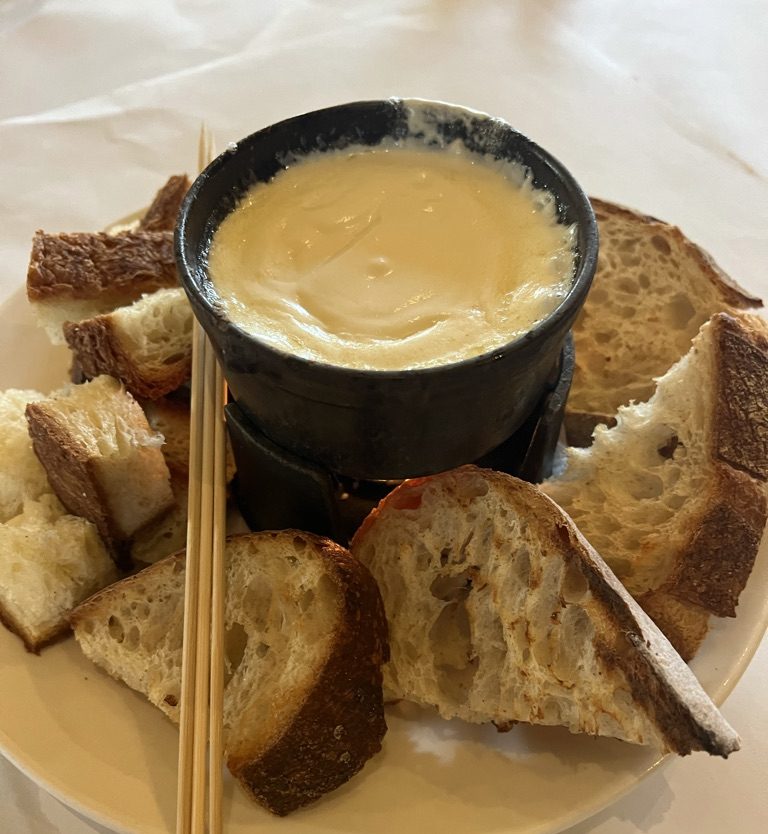 Left Bank's Cheese Fondue served with bread.