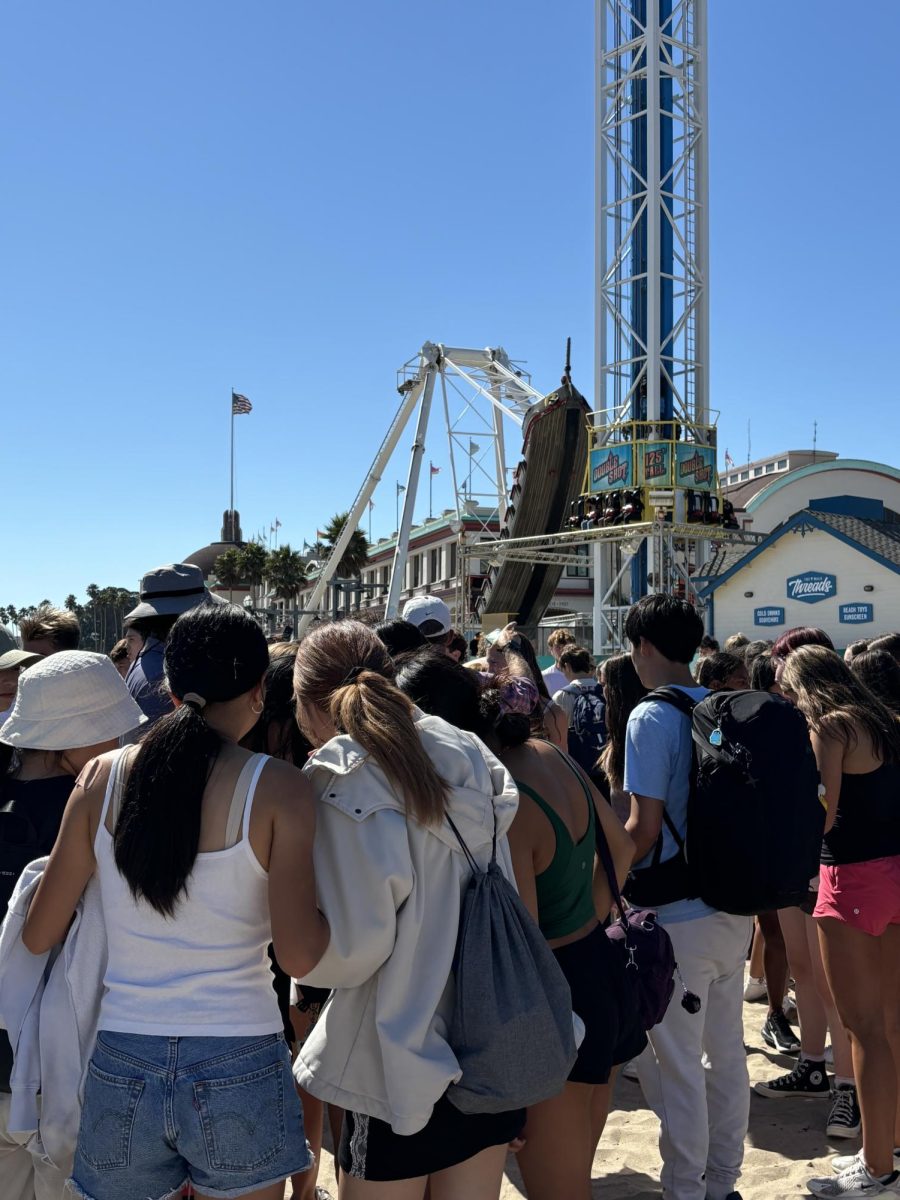 Sophomores gather at the beach behind the Santa Cruz Beach Boardwalk on the first day of the retreat. “I had such a good time at the Boardwalk going on all the rollercoasters and eating the delicious food,” sophomore Emily Li said.