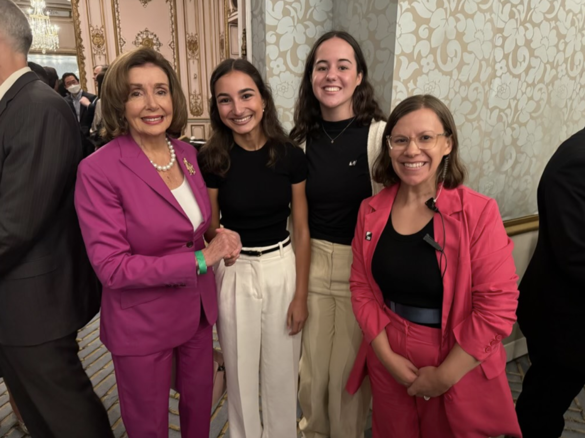 Former Speaker of the House Nancy Pelosi stands with seniors Sonia Dholakia and Lauren Mrva. Photo courtesy of Mrva