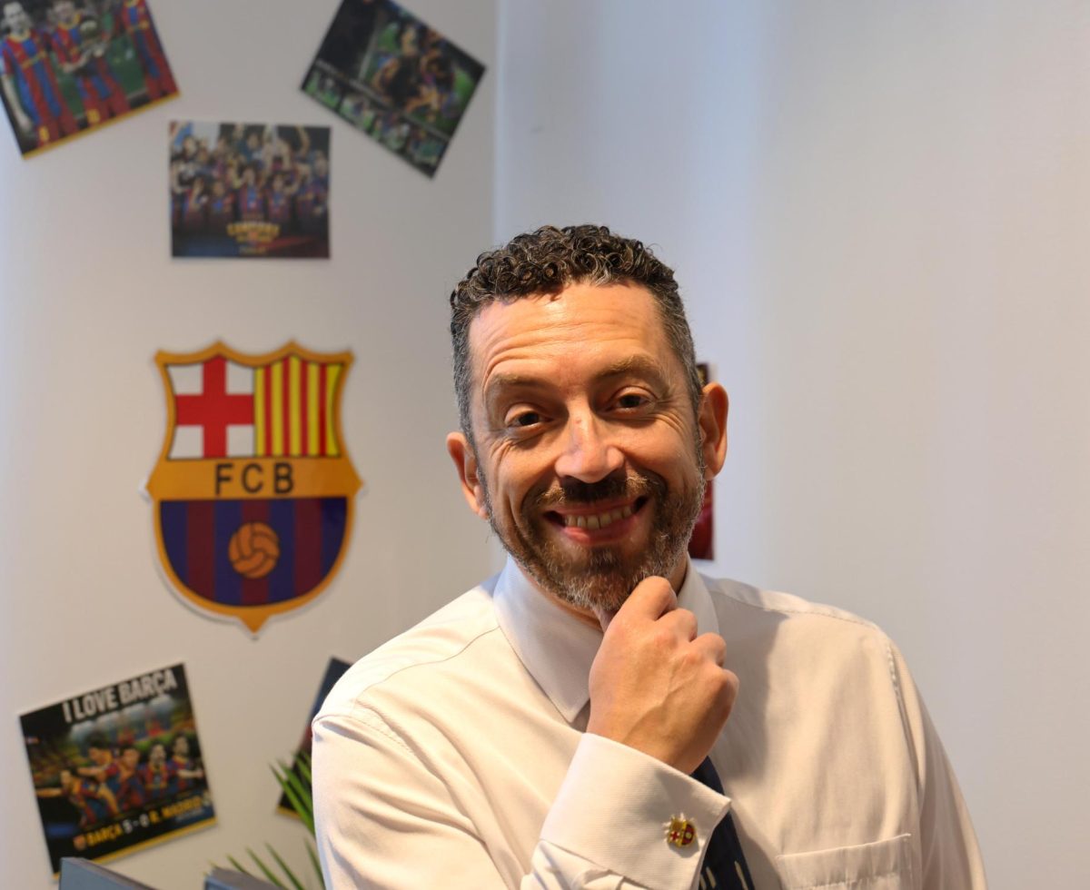 Marco Menéndez, Menlo's new EDIB director, shows off his FC Barcelona paraphernalia, including branded cuff links.