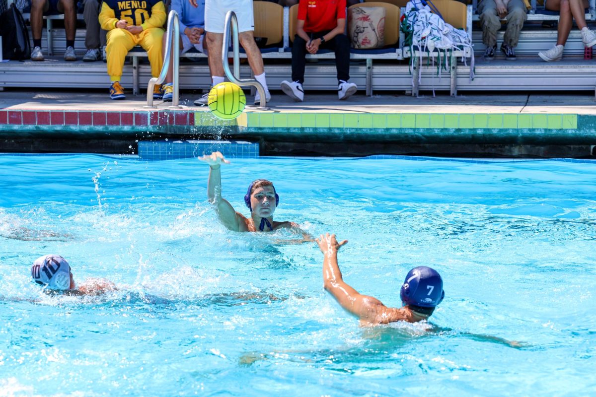 Freshman Hunter Coleman Passes the ball to his teammate at Roche Invitational on Sept. 6.