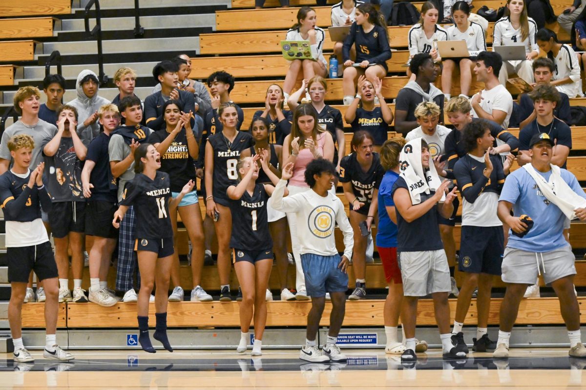 Tate Cohen and Scarlett Bundy (first row—from left), who are both Sea of Gold captions, cheer on the varsity volleyball team at home against Aragon on Aug. 29. Photo by Pam McKenney via Flickr.