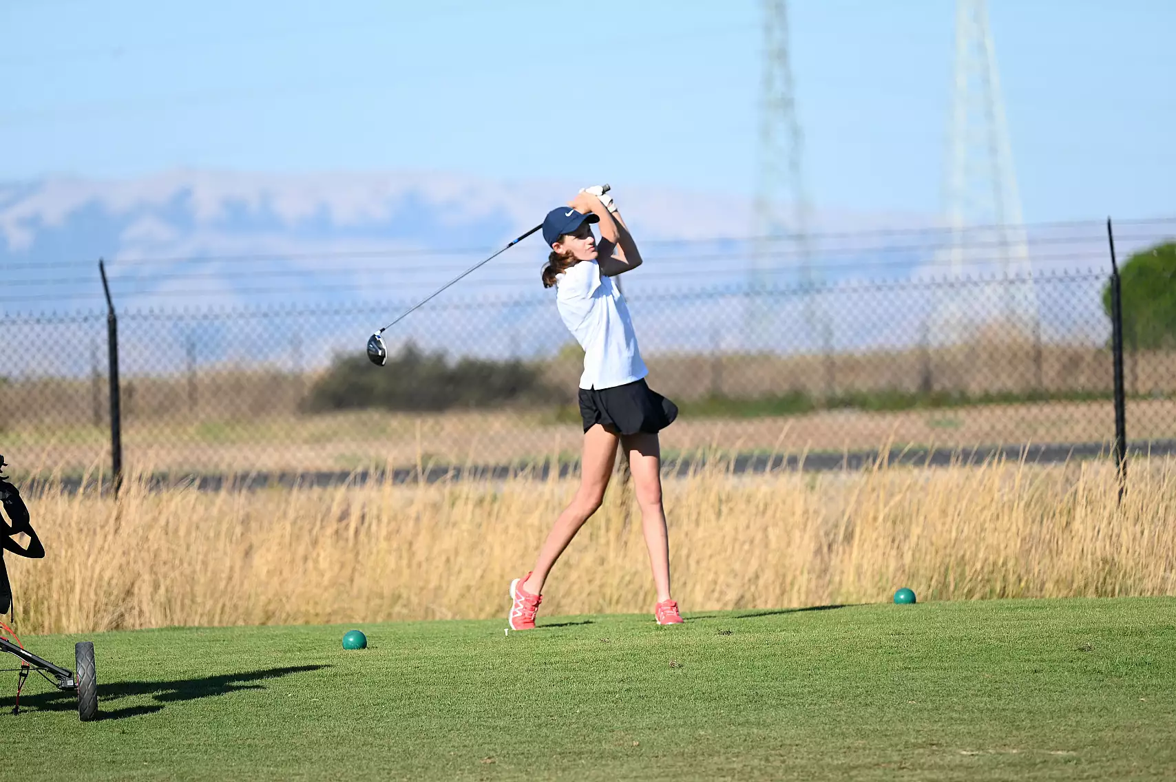 Freshman Elise Darling tees off at the Knights' season opener on Sept. 3. Photo courtesy of Pam McKenny.