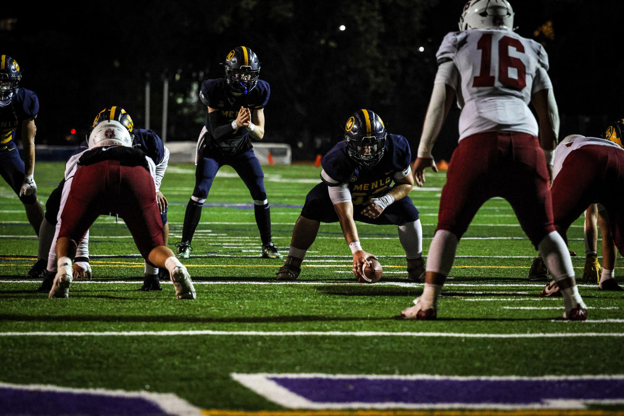 Sophomore Lawrence Latu snaps the ball to junior quarterback Jack Freehill.