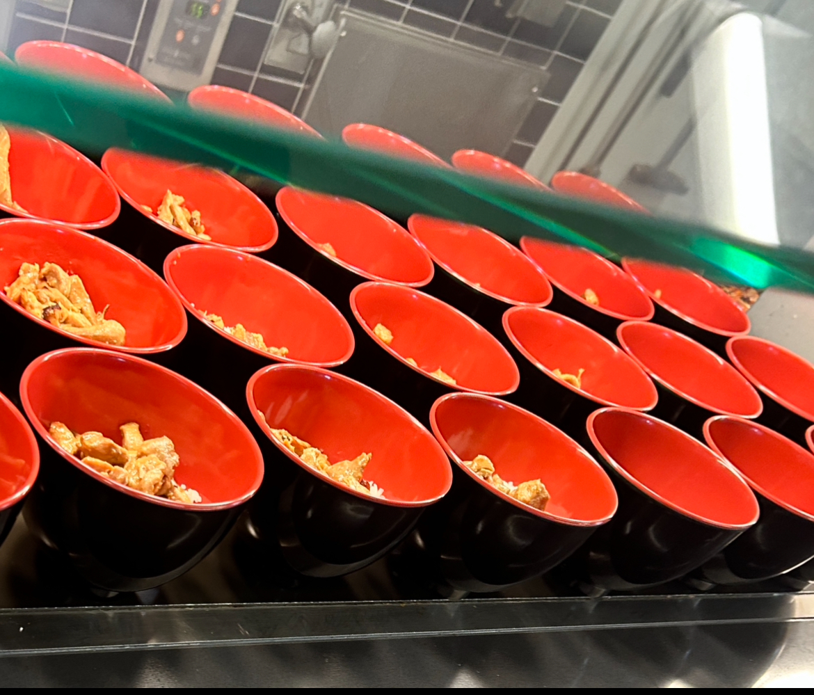 Lunch bowls with meat await students and staff.