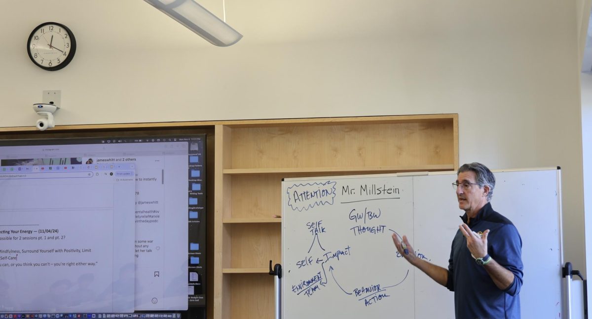 Golf coach Francis Santora talks during a Mental Game Monday session.