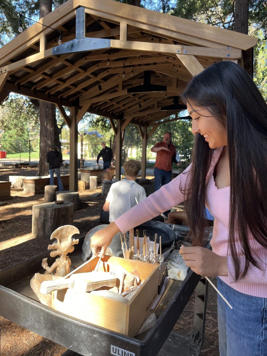 Senior Mari Martinez-Luna works on a project outside in science teacher David Spence’s Experimental Archaeology class.