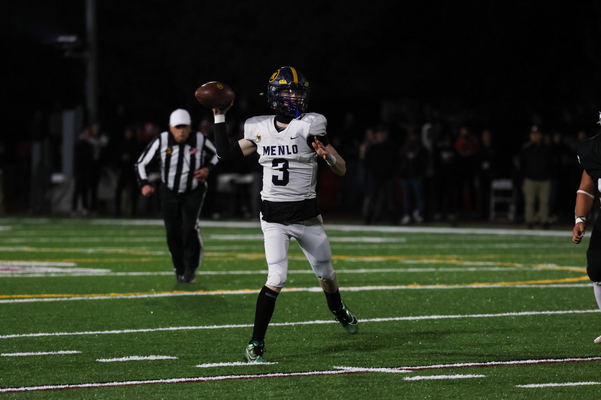 Junior quarterback Jack Freehill throws the ball on the run in the fourth quarter.