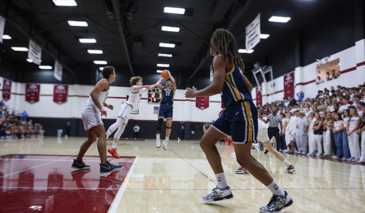 Junior Ethan Zhao shoots a jump shot over an SHP defender.