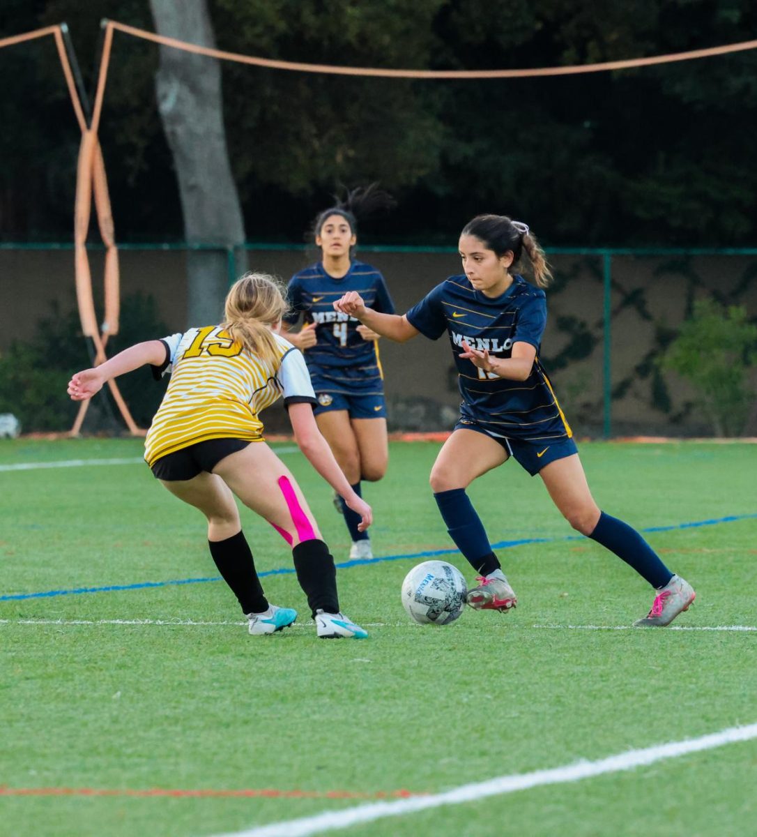 Junior Krista Arreola dribbles a soccer ball last season.