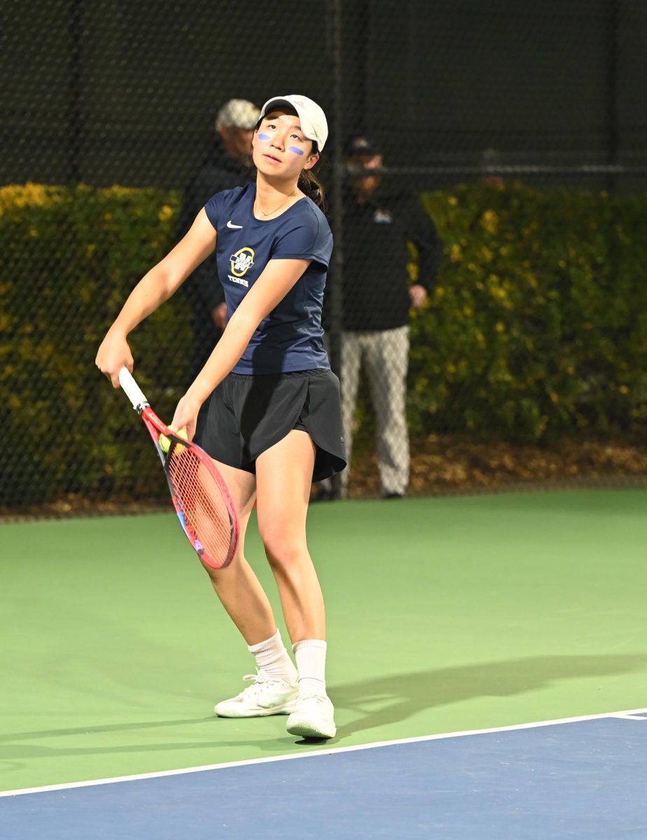 Freshman Celena Gao serves the
ball in her singles match at the
CCS finals. Photo courtesy of
Pam McKenney