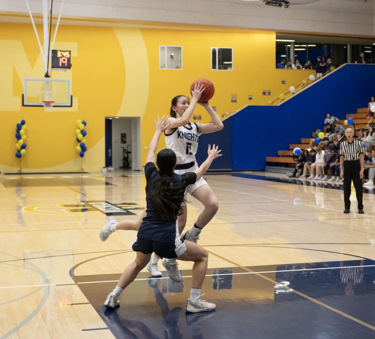 Senior guard Karen Xin rises to take a contested jump shot. Photo sourced via Menlo's Flickr page