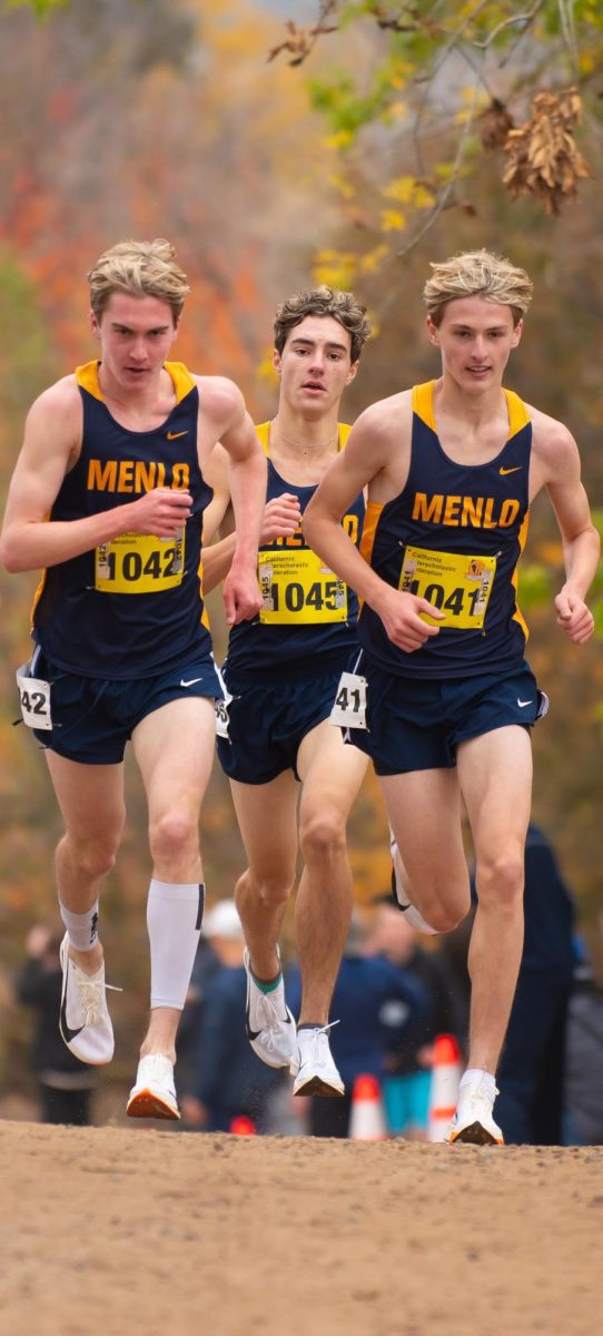 Seniors Will Hauser and Jared Saal
run with sophomore Henry Hauser.
Photo courtesy of Steve Pretre