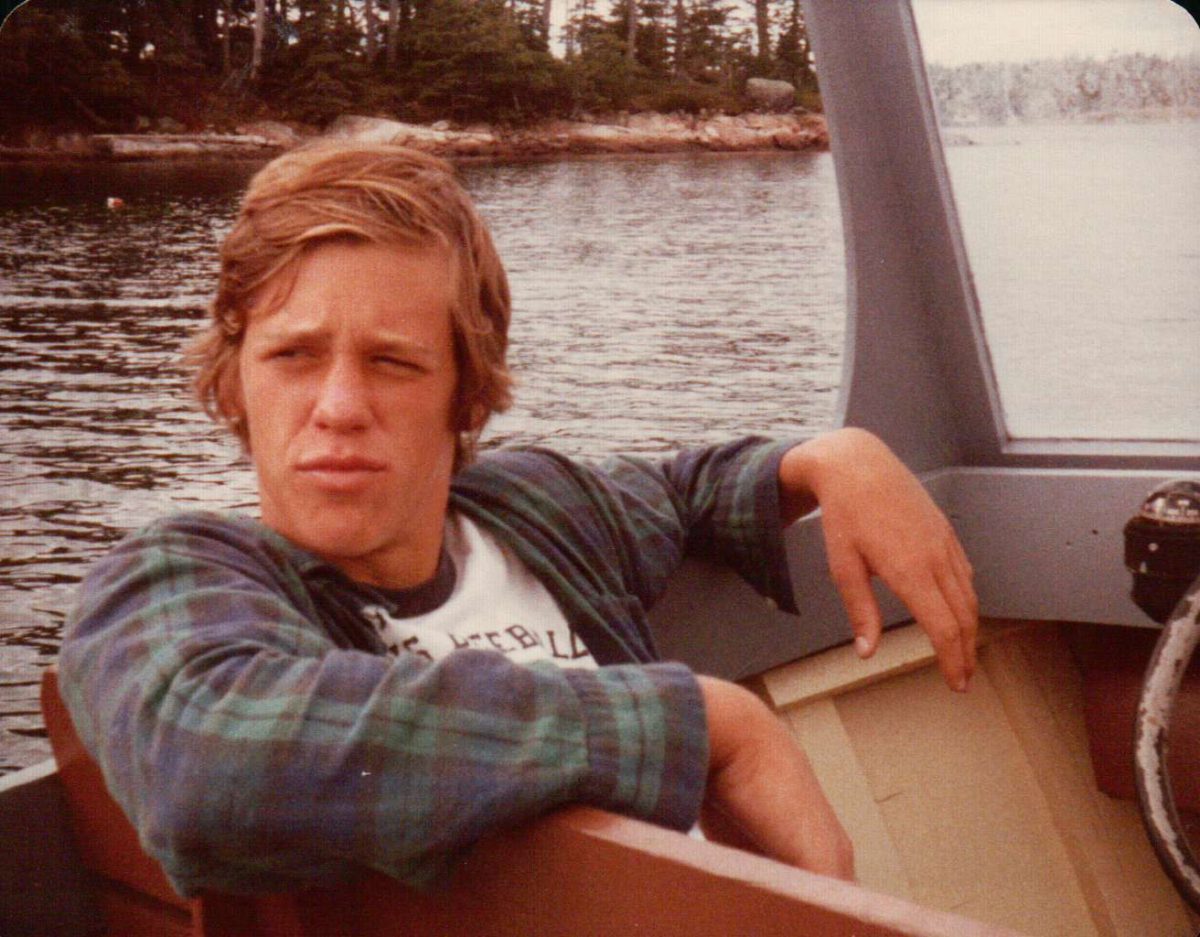 Upper School Director John Schafer poses on his family’s boat at age 18. Photo courtesy of Schafer