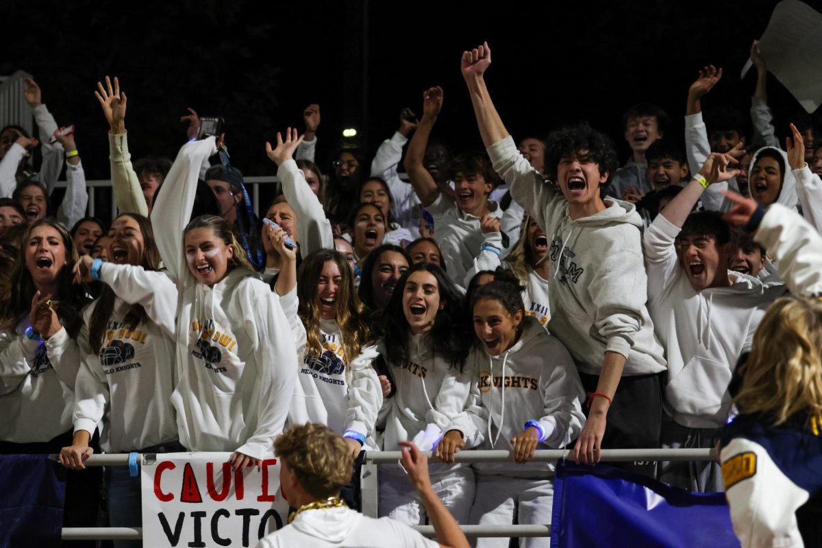 Seniors celebrate and cheer for Menlo at the 2024 Valpo Bowl.