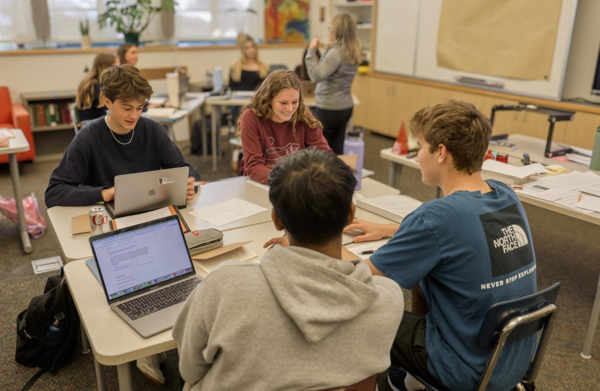 Junior Reid McLaughlin sits with seniors Audrey Hochstetler, Adi Garg and Ben Levin during Investigations, a mixed-grade English elective.