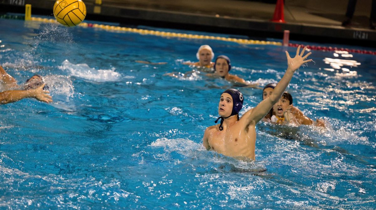 Sophomore Lincoln Bott goes up for a shot block.
