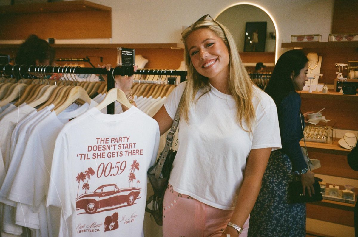 Lauren Lawson poses with clothing from her brand Last Minute at Atlas, a boutique in Santa Clara’s Valley Fair Mall.