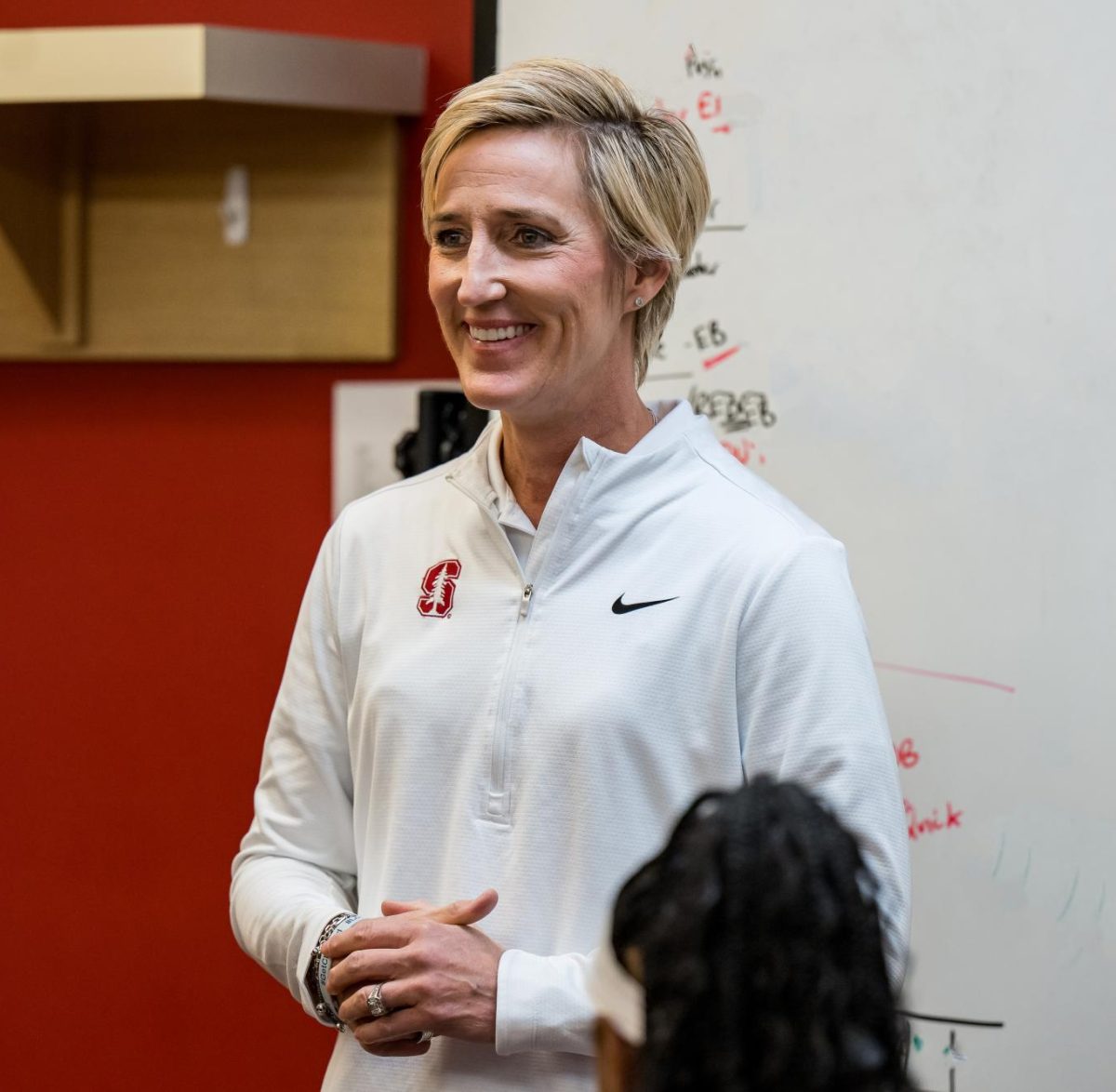 Stanford women’s basketball head coach Kate Paye reviews plays during a team meeting. 
